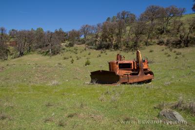 Rusty bulldozer in a field